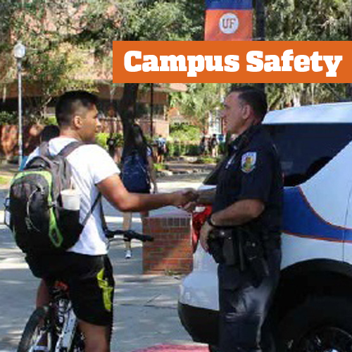 photo of student shaking hands with police officer